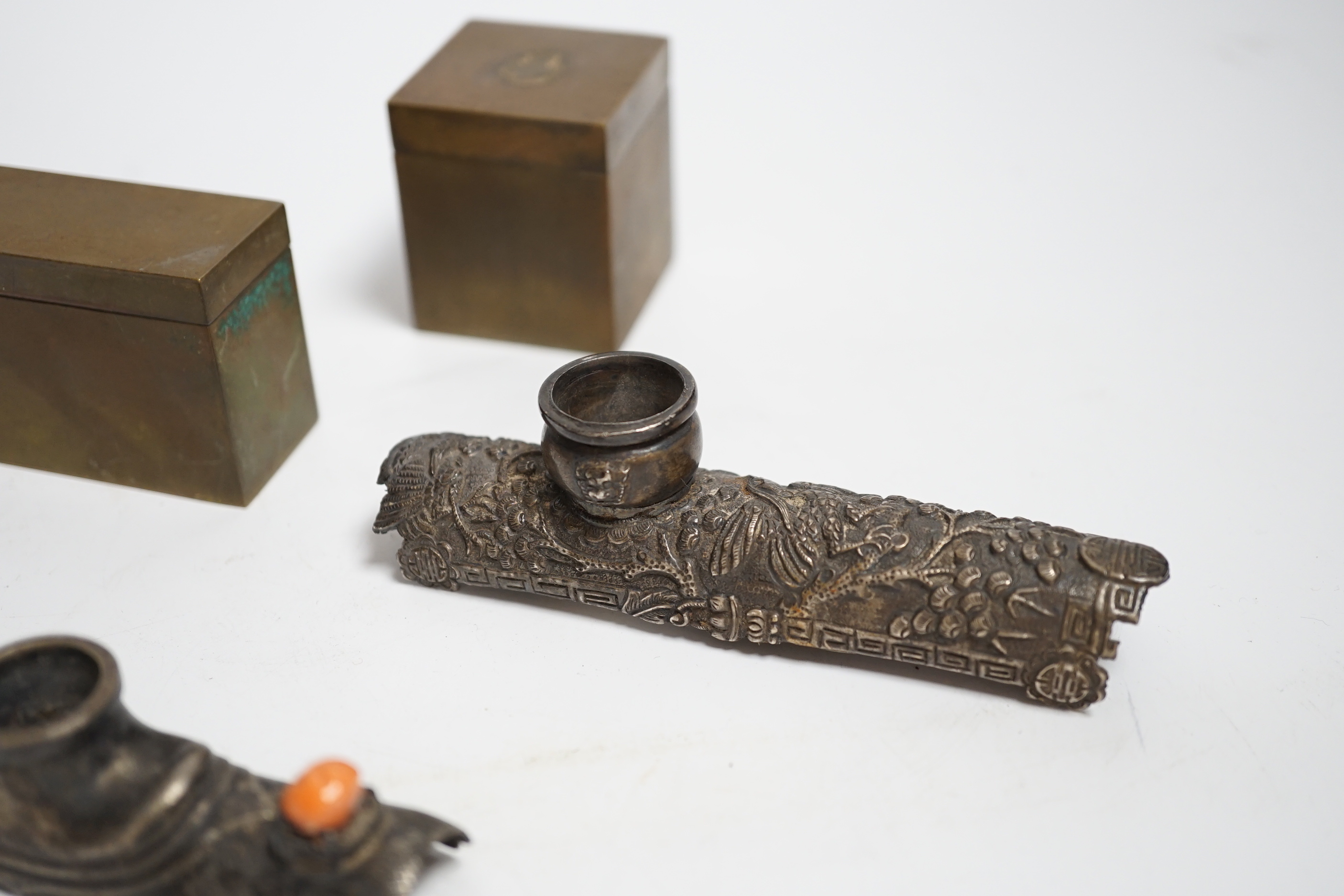 Two white metal opium pipe heads and two opium boxes (mid 20th century)